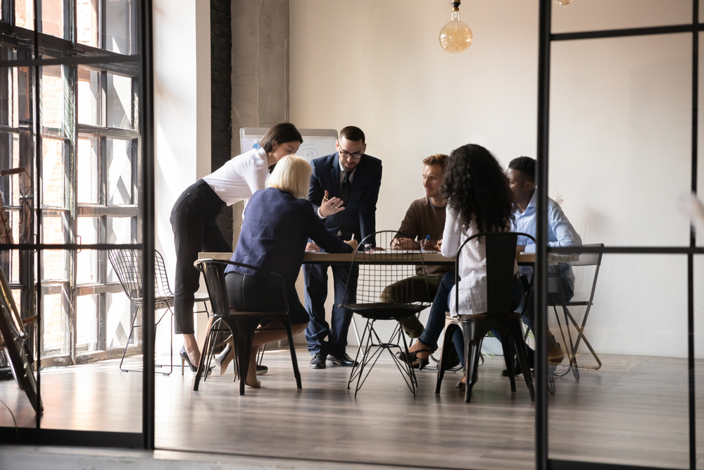 a group of people in a meeting