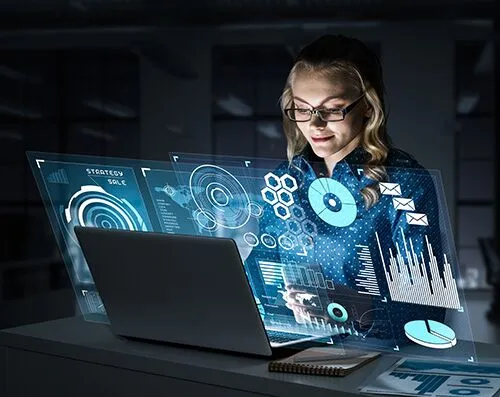 a woman in front of laptop with different graphs