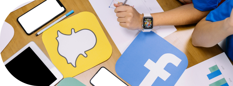 a woman wearing a smartwatch and social media icons on the table
