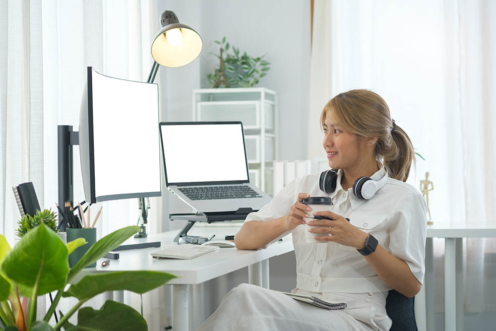 web designer reviewing a website on a large monitor web designer reviewing a website on a large monitor