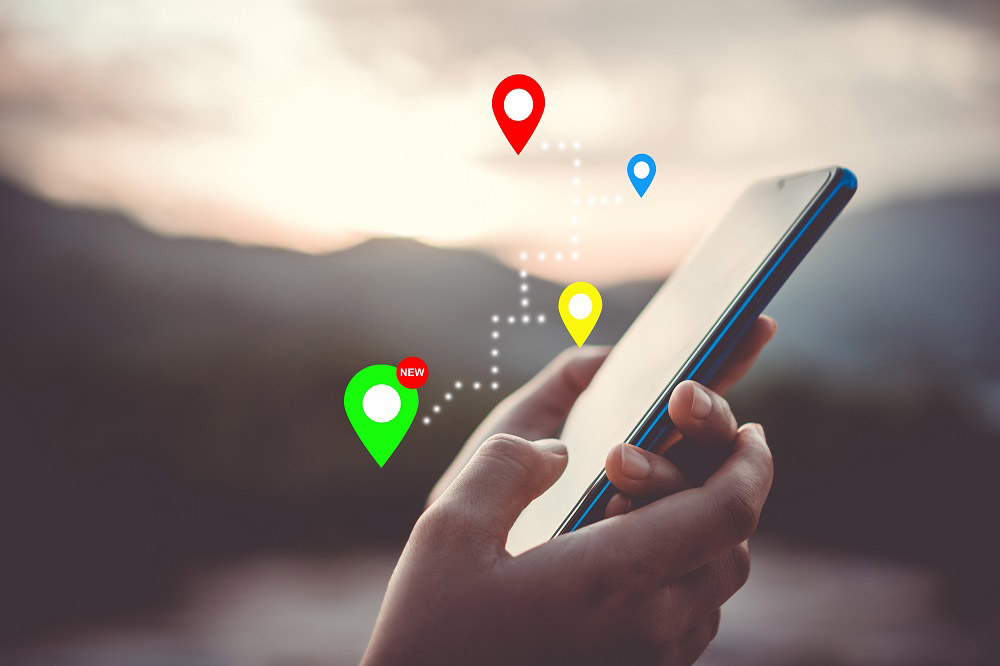 man using his phone to check Google Maps man using his phone to check Google Maps