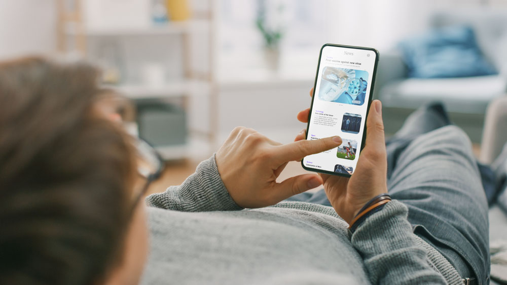 person’s POV while browsing social media on a mobile device